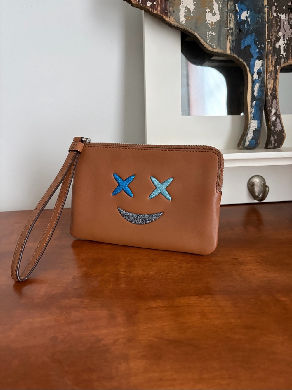 Coach Brown Leather Wristlet with Blue Smiley Detail